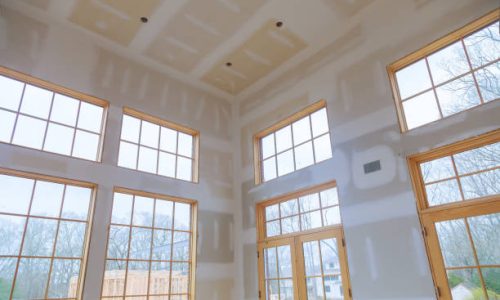 Construction building industry new home construction interior drywall tape and finish details installed door for a new home before installing